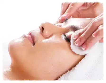 Woman receiving a relaxing facial.